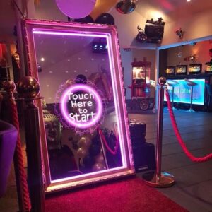 Transform Your Event with an Interactive Mirror Photo Booth Experience: Customizable Features and Keepsake Photos!