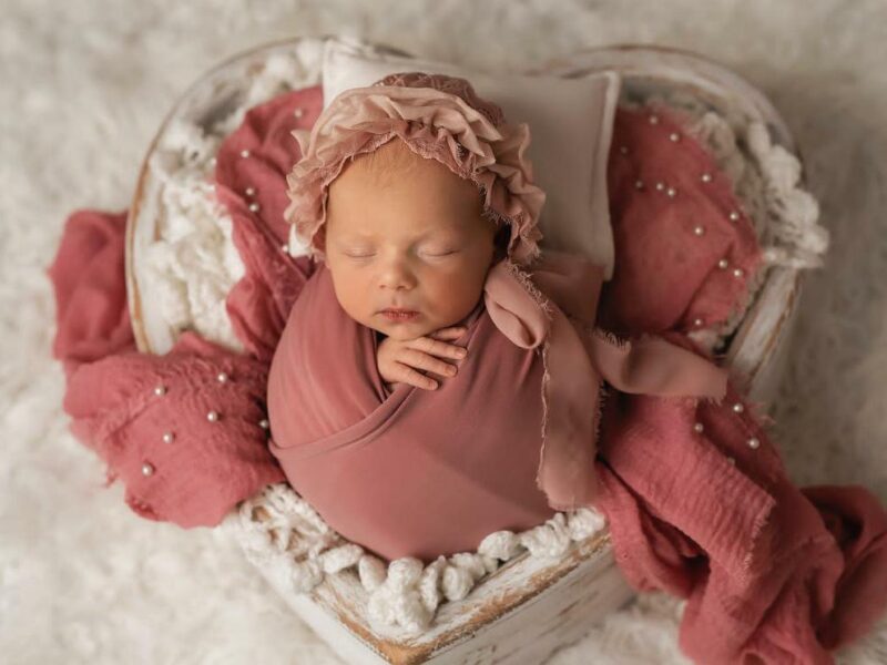Experienced Newborn Photographer Creating Timeless and Safe Memories of Your Precious Little One