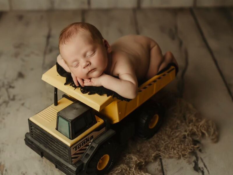 Artistic Newborn & Family Portraits: Relax and Let Us Do the Work! 13 Years of Experience and a Studio Full of Props for Unique Photos.