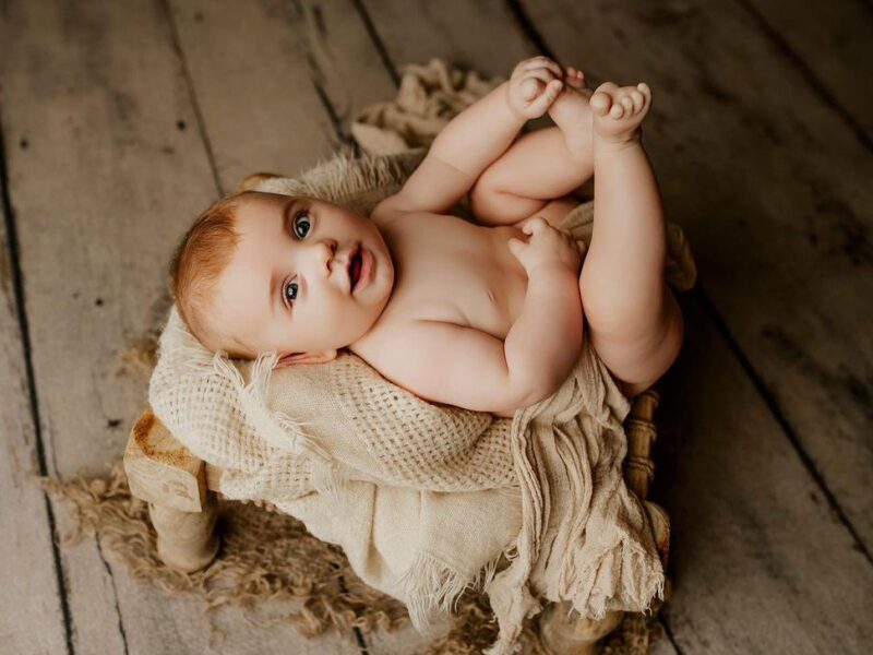 Artistic Newborn & Family Portraits: Relax and Let Us Do the Work! 13 Years of Experience and a Studio Full of Props for Unique Photos.