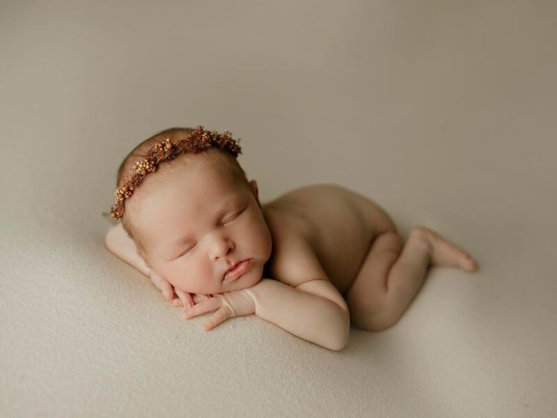 Artistic Newborn & Family Portraits: Relax and Let Us Do the Work! 13 Years of Experience and a Studio Full of Props for Unique Photos.