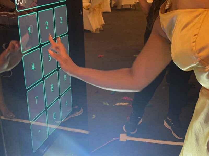 Step into Your Reflection: Rent Our 6-Foot Mirror X Photobooth with Touchscreen and Customized Animations for Your Next Party!