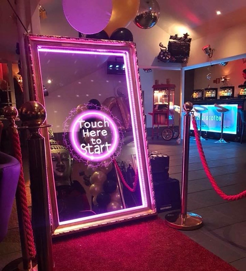 Transform Your Event with an Interactive Mirror Photo Booth Experience: Customizable Features and Keepsake Photos!